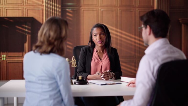 Couple says an older neighbor fixated on the girlfriend, parked in her reserved spot, and turned their apartment life into a court fight — while a second man was allegedly trying to break in at the same time