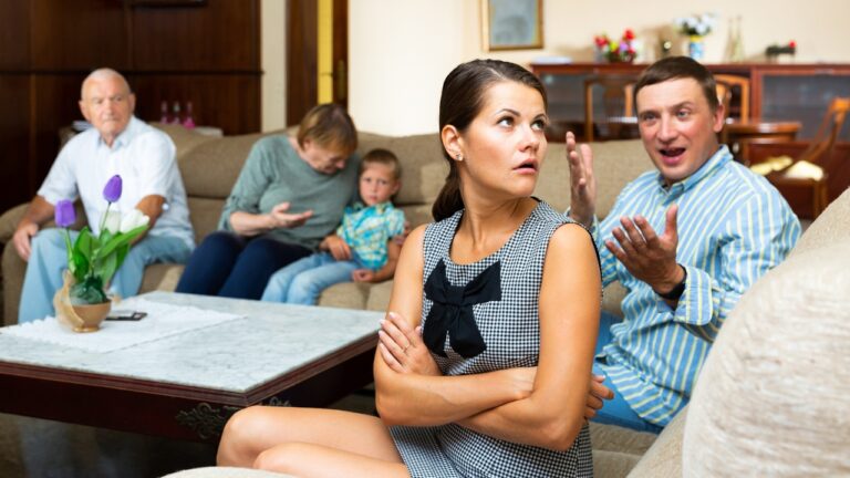 Woman says her husband’s family booked a 5-to-6-week stay in their 2-bedroom apartment without asking her — and now she wants to leave while they’re there